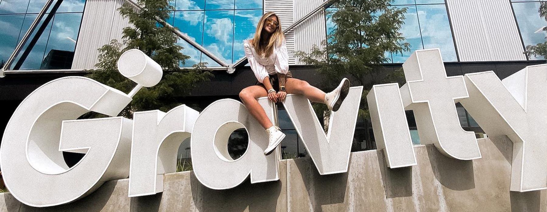 a person sitting on a sign
