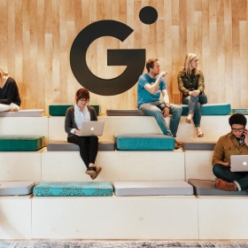 a group of people sitting on large stairs