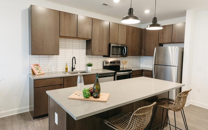 a kitchen with an island and chairs
