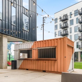 an empty food stand in a courtyard